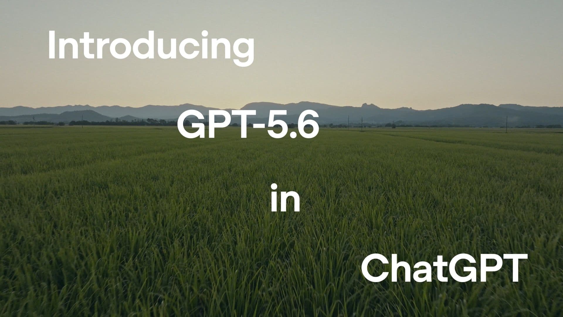 A field beneath distant hills with the words Introducing GPT-5.6 in ChatGPT.